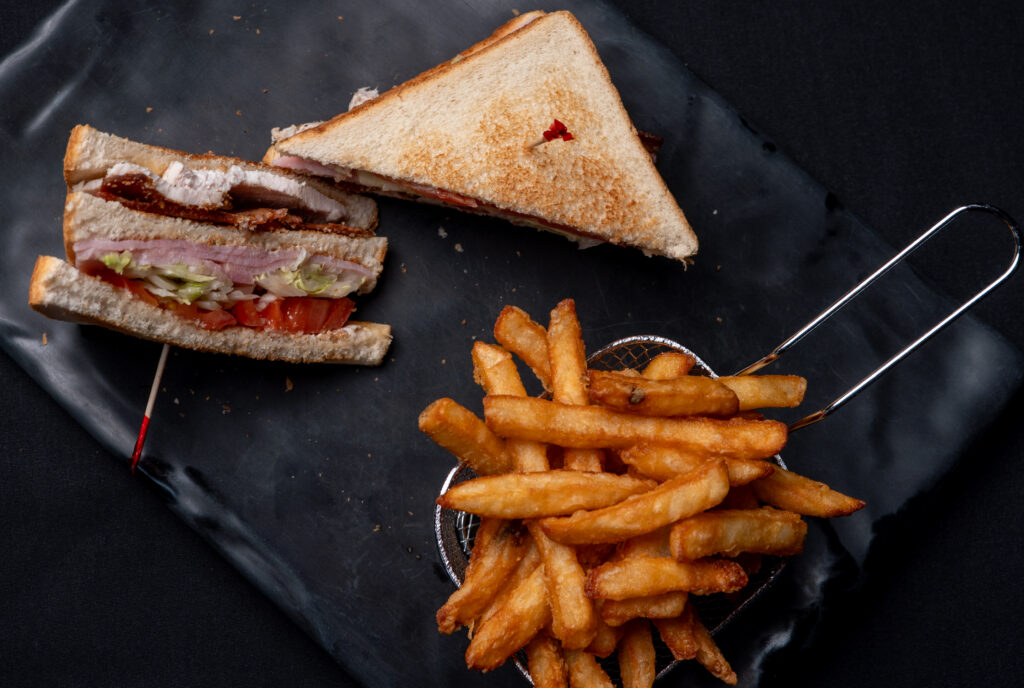Clubhouse sandwich with fries at Jackpot Grill, Grande Prairie