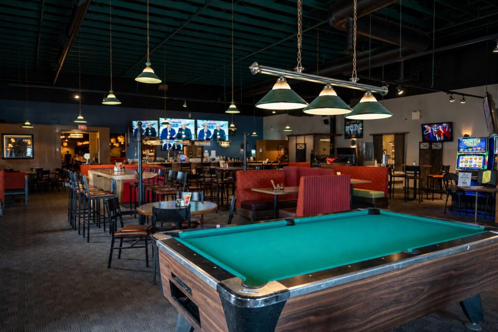 Lounge with sports bar and pool tables at Jackpot Grill, Grande Prairie